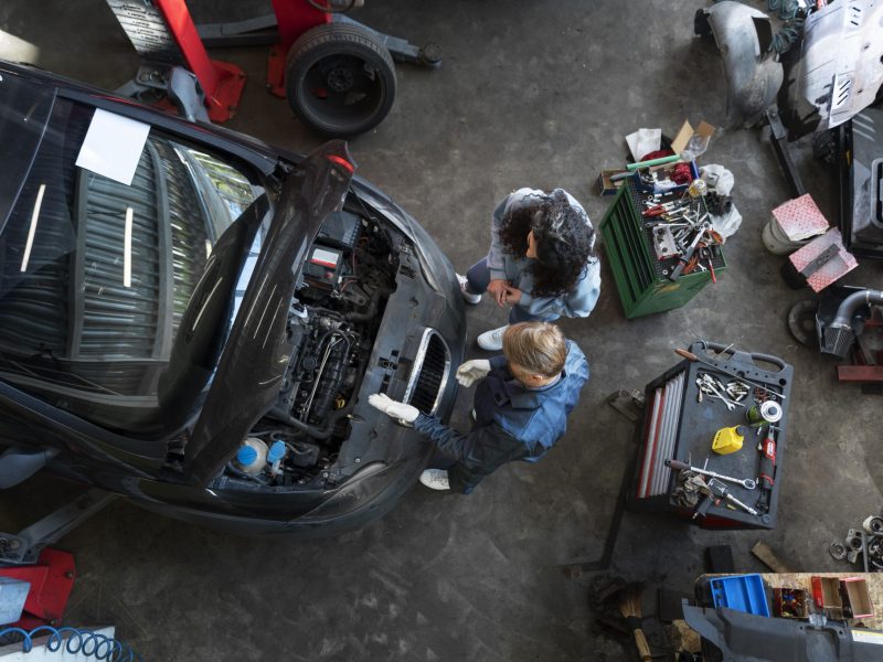 top-view-man-repairing-car (1)